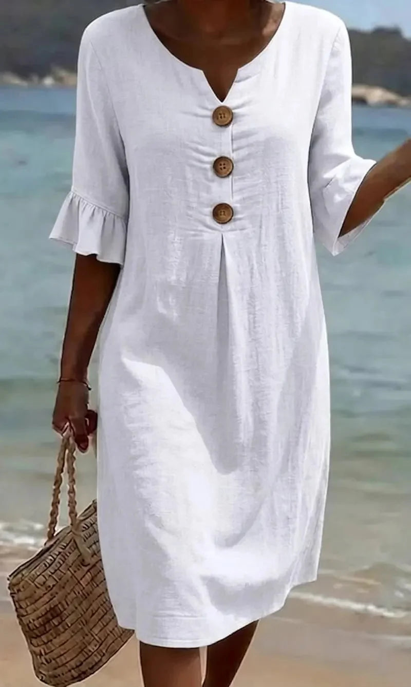 Moteriška suknelė su pūstomis rankovėmis ir sagomis