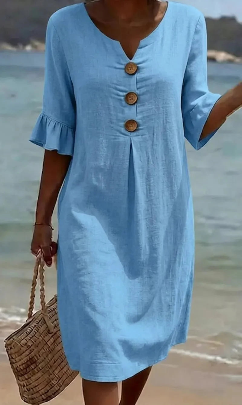 Moteriška suknelė su pūstomis rankovėmis ir sagomis