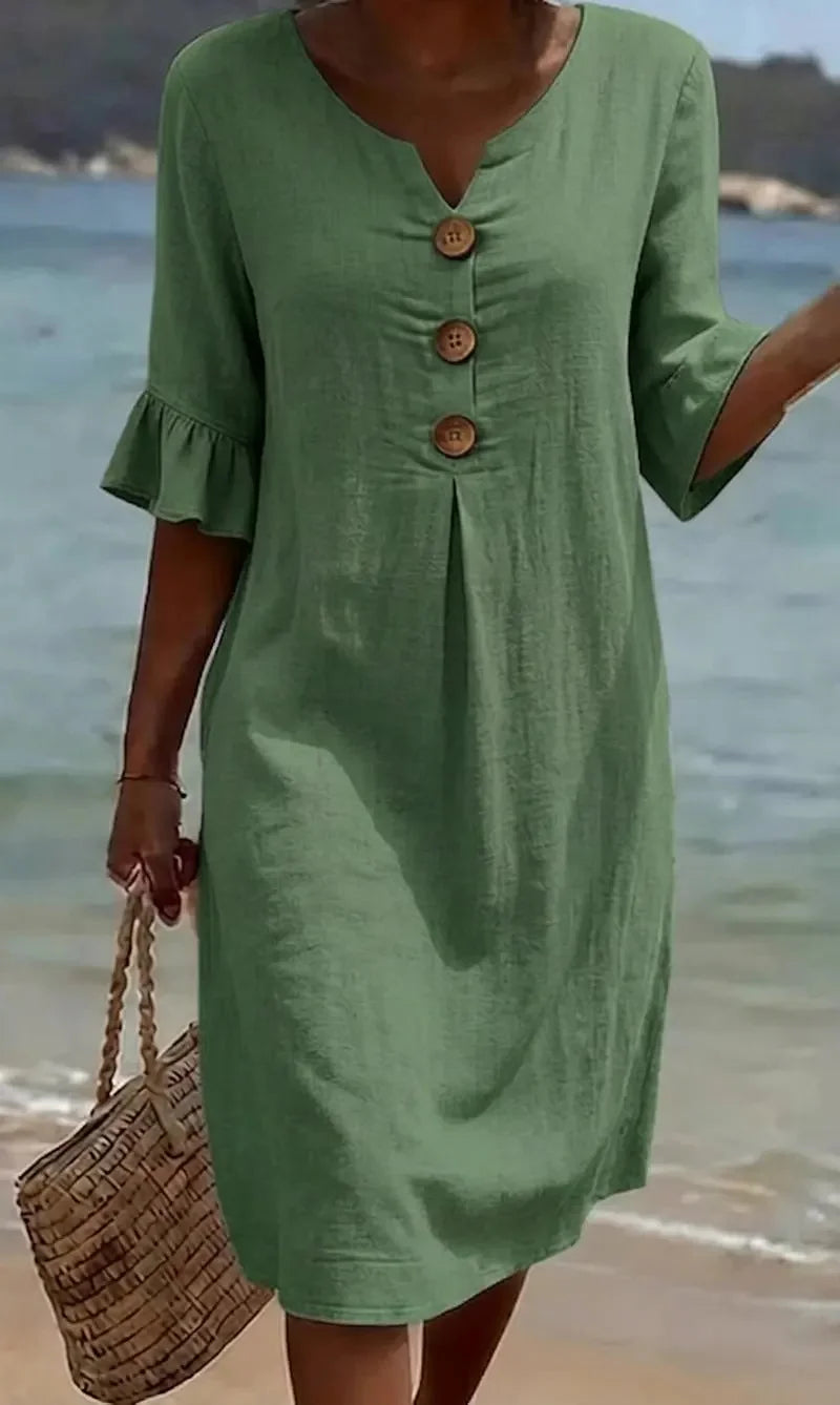 Moteriška suknelė su pūstomis rankovėmis ir sagomis